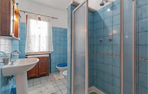a bathroom with a shower and a sink and a toilet at Villa Altea in Itri