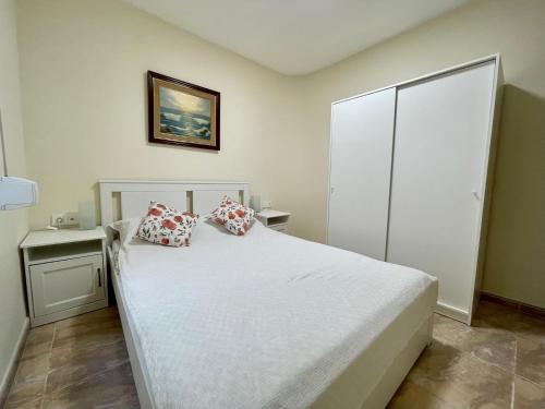 Postel nebo postele na pokoji v ubytování Oliva Seaside Apartments