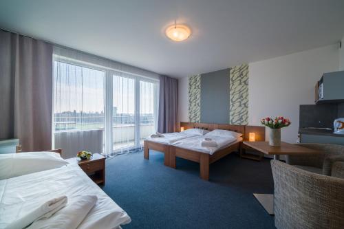 Voodi või voodid majutusasutuse Garni Hotel Třeboň toas