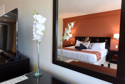 Katil atau katil-katil dalam bilik di Camberland Resort & Spa Ramallo