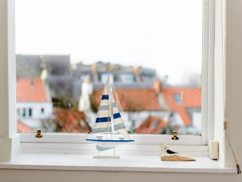 a small toy boat sitting on a window sill at Bass Rock View in North Berwick