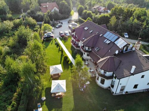an aerial view of a house with a yard at Natura Family Resort in Avrig