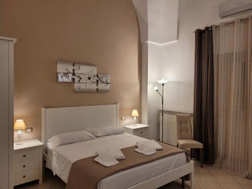 Säng eller sängar i ett rum på Casal Sant'Angelo