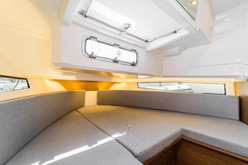 a small room in a train car with a window at Embarcación Jeanneau Merry Fisher Sport 895 BICHO II in Ayamonte