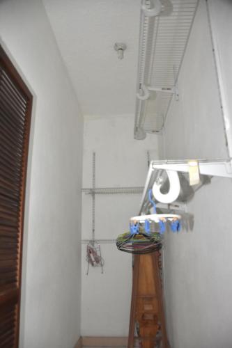 a bathroom with a ladder and a toilet paper dispenser at Embassy Deluxe apartment in Kingston