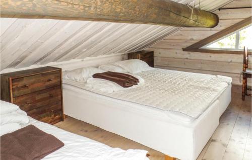 a bedroom with two beds in a attic at Beautiful Home In Trysil With 10 Bedrooms, Sauna And Internet in Mælem