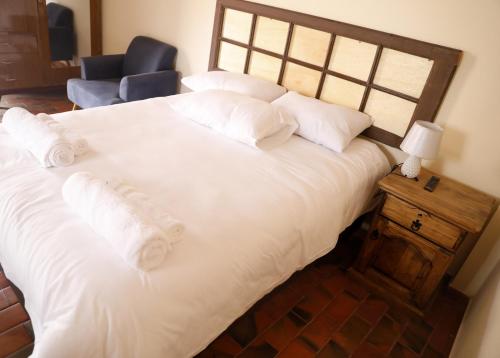 Una cama o camas en una habitación de Olala house
