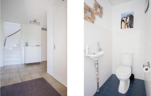 a bathroom with a toilet and a sink at Amazing Home In Workum With Wifi in Workum