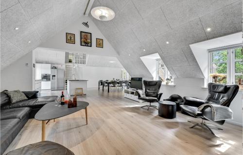 a living room with a couch and chairs and a table at Lovely Home In Ulfborg With Sauna in Øhuse