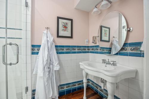 a bathroom with a sink and a mirror at Summit Street Inns in Winston-Salem