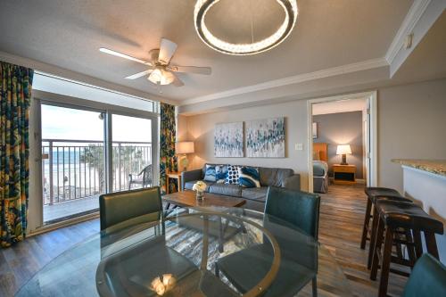 a living room with a couch and a table at A Piece of Paradise, Newly Renovated in Myrtle Beach