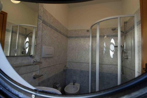 a bathroom with a shower and a sink at Hotel L'Approdo in Anzio