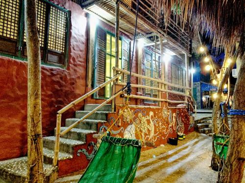 a room with stairs and a painting on the wall at Capiz Beach Villa family room for 6 pax in Calatagan