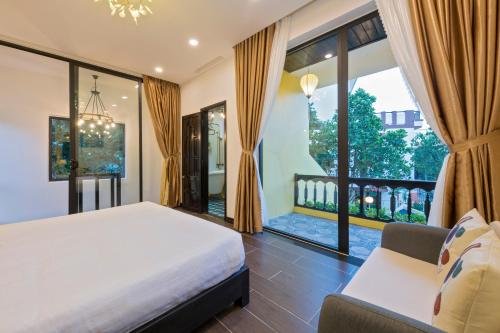 a bedroom with a bed and a large window at Hoi An Rosie Villa - 2 Bedrooms with Private Pool and Local Hoi An Decor in Hoi An