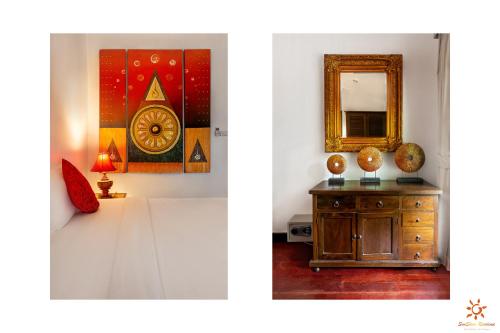 a room with a mirror and a wooden dresser at Sunshine Residence in Baan Tai