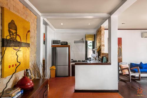 a kitchen with a counter top in a room at Sunshine Residence in Baan Tai