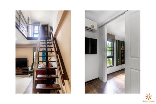 a staircase leading to a living room and a hallway at Sunshine Residence in Baan Tai