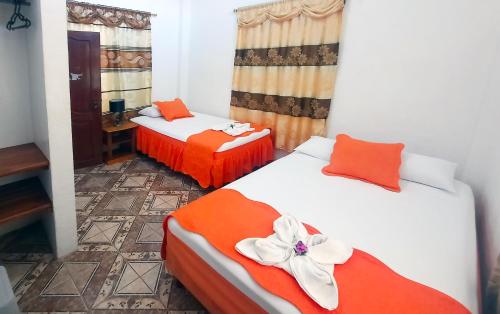 Letto o letti in una camera di Cielo Azul Galápagos Hotel