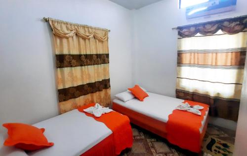 Letto o letti in una camera di Cielo Azul Galápagos Hotel