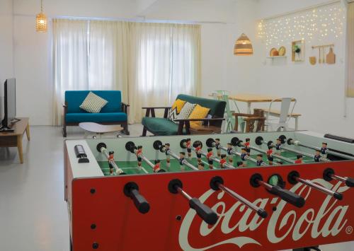 a large coca cola pool table in a living room at "Cloth Art Homestay" walk to Pahlawan & Jonker by Shine Stay in Melaka