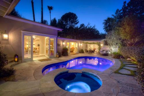 a swimming pool in the backyard of a house at Luxury Beverly Hills Suite in Beverly Hills