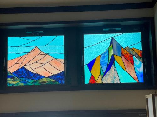 a pair of stained glass windows in a room at Tsuyukusa in Takayama
