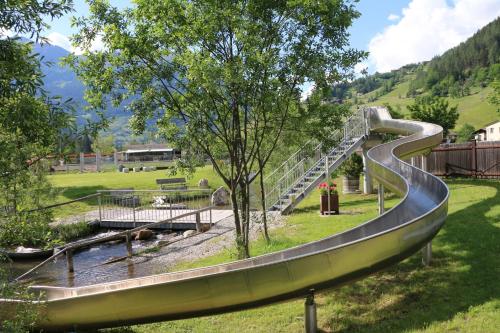 a slide in a park with a slide at Apartment Haus Christina in Großkirchheim