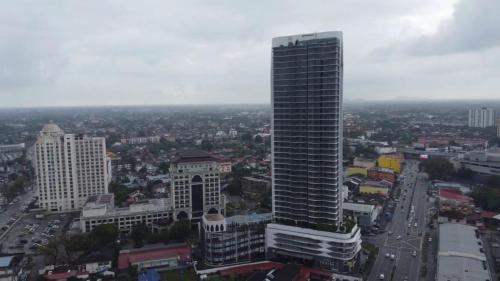 a view of a city with a tall building at Izz'man Homestay Level 33 Troika Kota Bharu in Kota Bharu