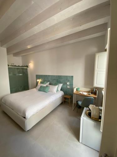 Ένα ή περισσότερα κρεβάτια σε δωμάτιο στο Residence Le Tre Grazie - Appartamento Tàlia