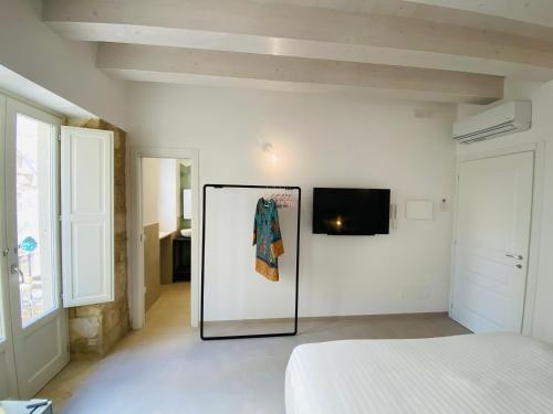 Ένα ή περισσότερα κρεβάτια σε δωμάτιο στο Residence Le Tre Grazie - Appartamento Tàlia