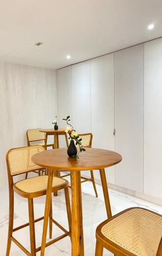 a dining room with two tables and chairs at suye hotel in Taichung