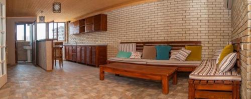 a living room with a couch and a table at Hotel Phaliashvili in Batumi