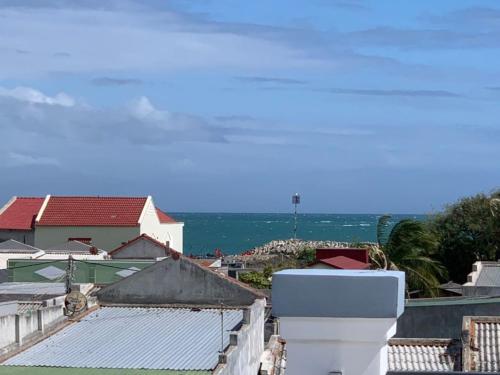 a view of the ocean from the roof of a house at Nomad Stay in Phan Rang