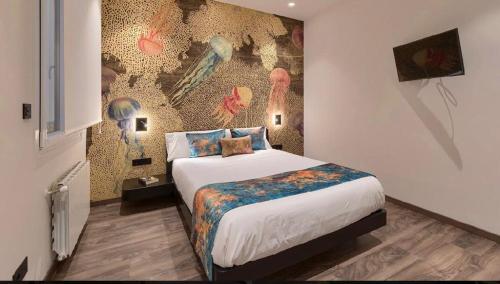 a bedroom with a bed and a wall with birds at Abando Suites by Next Stop Bilbao in Bilbao
