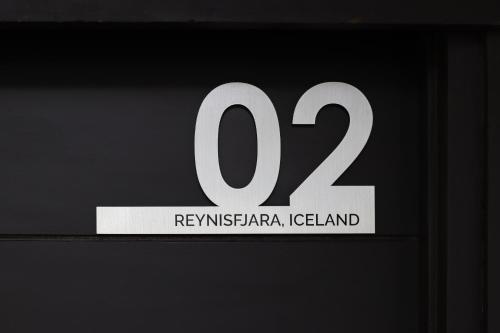 a white sign with the number on it at Nuuk Taal Lake in Laurel