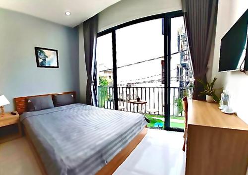 Postel nebo postele na pokoji v ubytování Sunny Homestay Hoi An