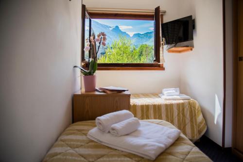 Postel nebo postele na pokoji v ubytování Hotel Marguareis