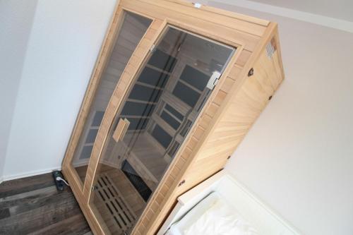 a large glass door on the wall of a room at Dünentau in Norden