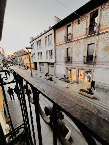 a group of people walking down a street with buildings at Gegix's House Rho in Rho