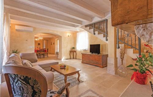 a living room with a couch and a table at Holiday Home Vodnjan With Fireplace I in Vodnjan