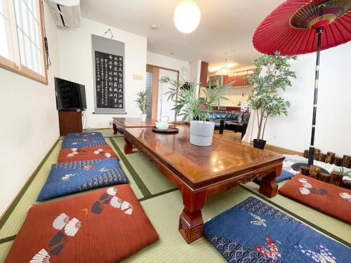 a living room with a wooden table and two chairs at Japanese style villa - Vacation STAY 10392 in Tokyo