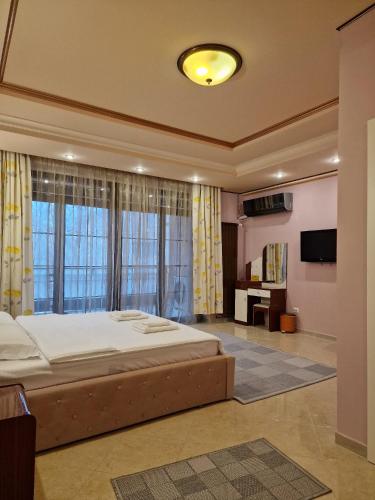 Кровать или кровати в номере Francesca Residence