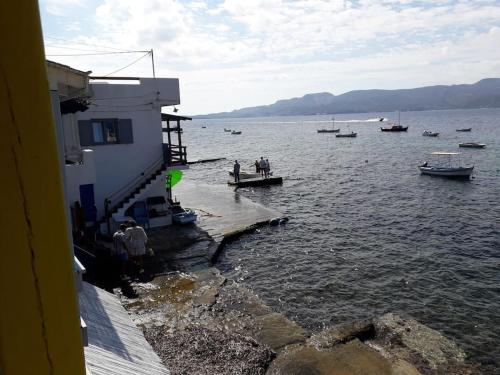 a group of people on a boat in the water at The Yellow Boat House in Klima
