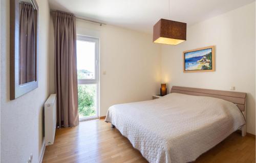 Postel nebo postele na pokoji v ubytování Beautiful Home In Makarska With Sauna