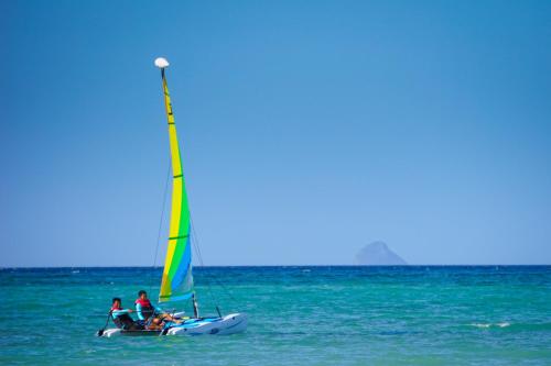 a group of people on a sailboat in the ocean at Kandaya Resort in Daanbantayan
