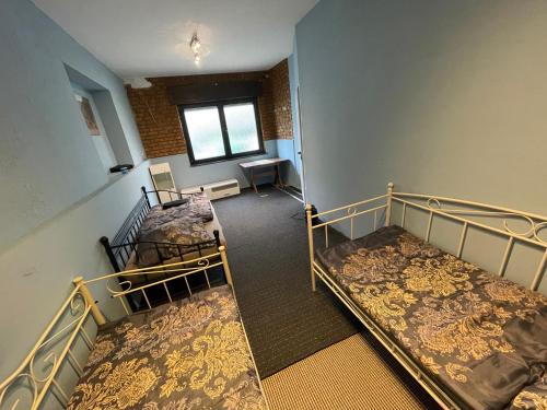 a room with two bunk beds and a window at Apartment Breite Straße zwischen Köln und Aachen in Kerpen