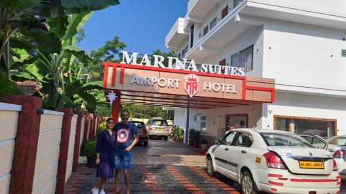 a group of people standing in front of a hotel at MARINA SUITES AIRPORT HOTEL in Cochin