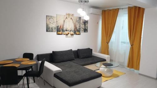 a living room with a couch and a table at Luxury apartament in Dudu