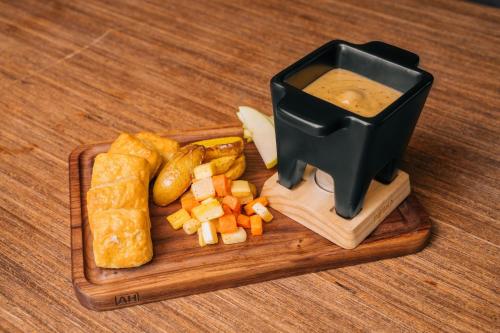 a tray of food with bread and vegetables on a table at Residence Inn by Marriott Big Sky/The Wilson Hotel in Big Sky