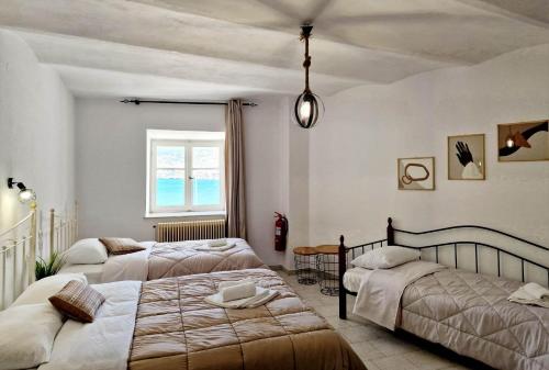 Ένα ή περισσότερα κρεβάτια σε δωμάτιο στο Casa di Syrii
